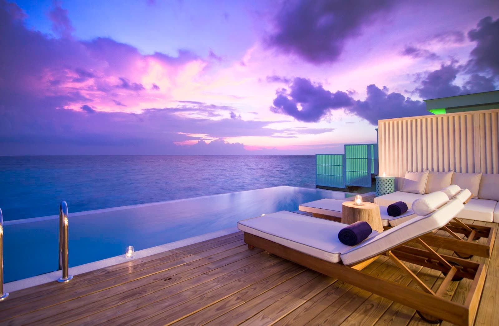 Breathtaking sunset views from a private overwater deck.