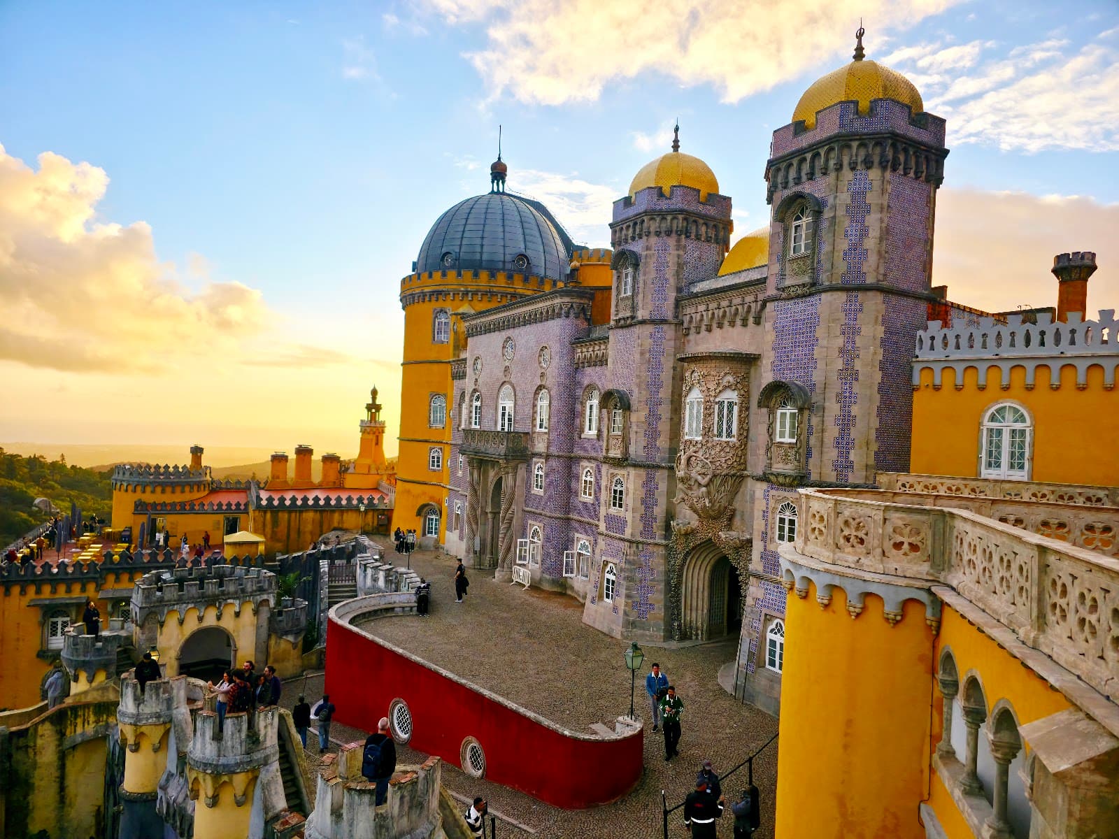 Sunset view of the palace courtyard and domes.