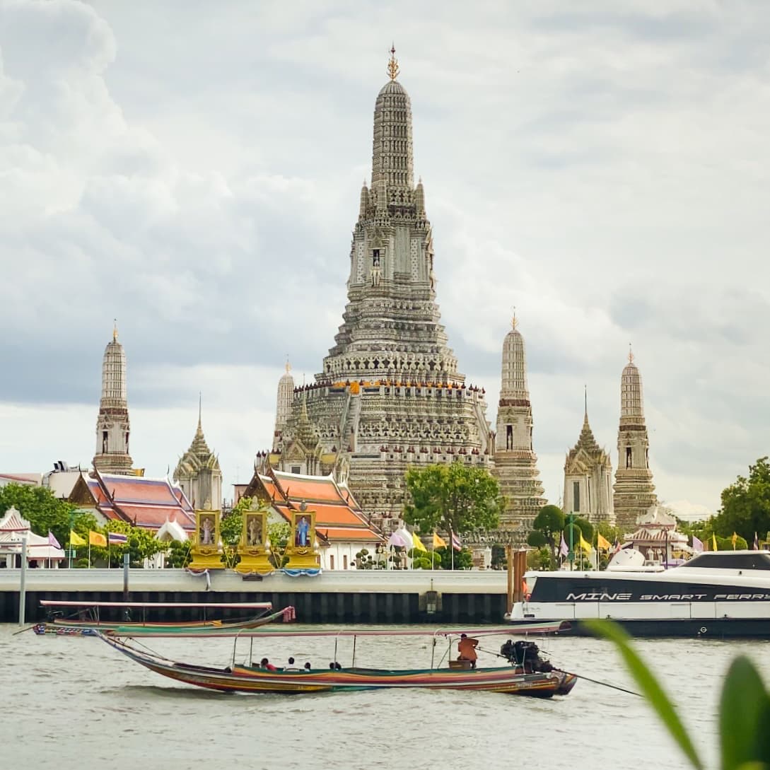 Iconic riverside view of Wat Arun Temple of Dawn.