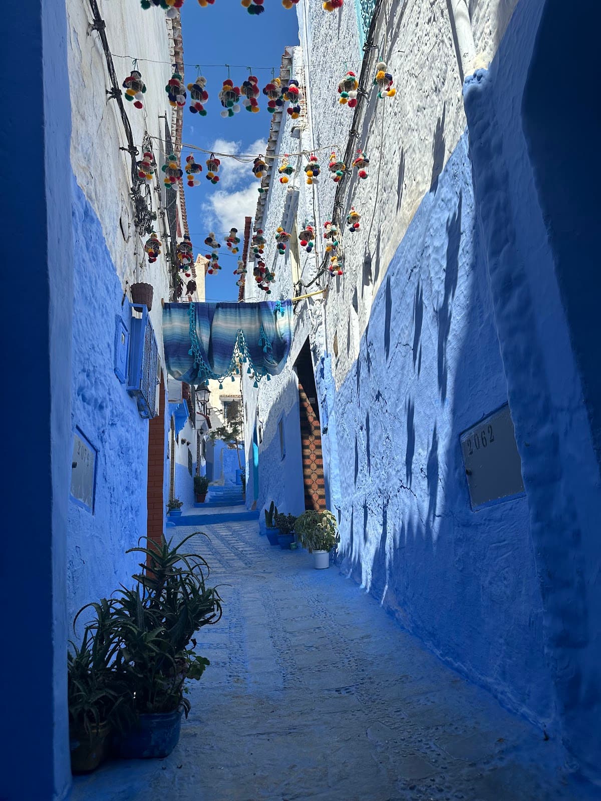 Iconic blue-washed alleyway in the Chefchaouen Medina.