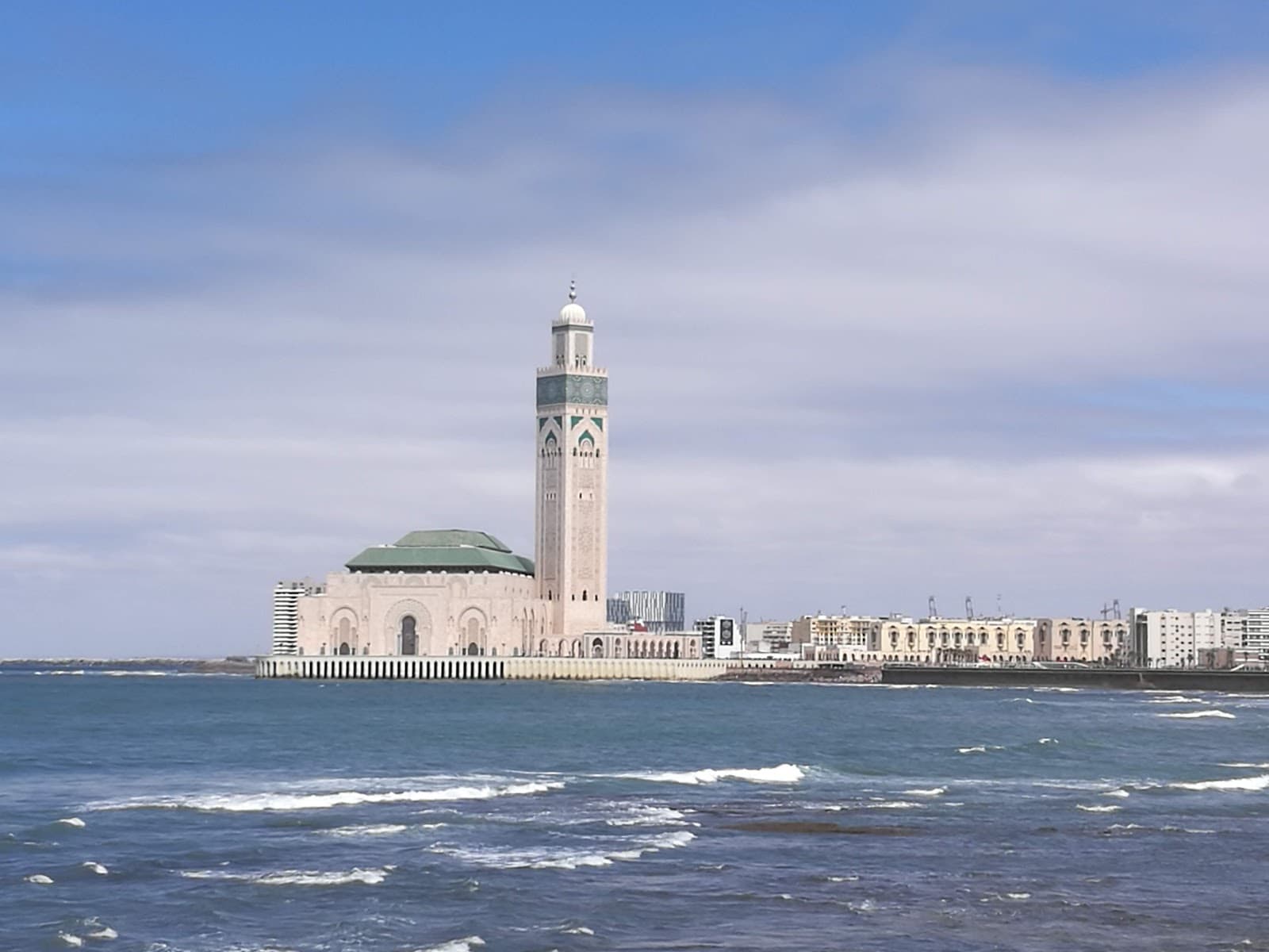 Stunning coastal view of the iconic Hassan II Mosque in Casablanca.