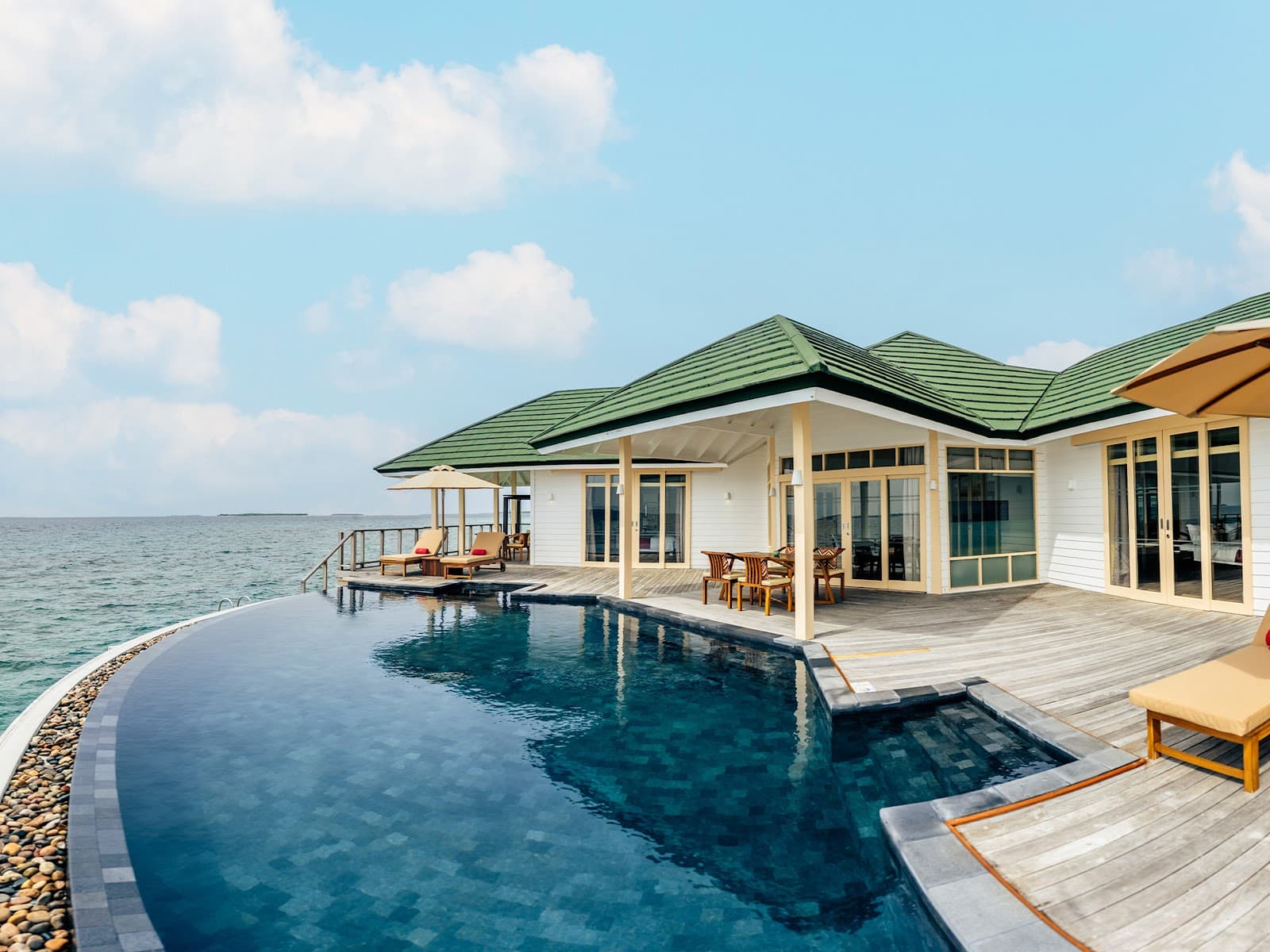 Luxury overwater villa with private infinity pool.