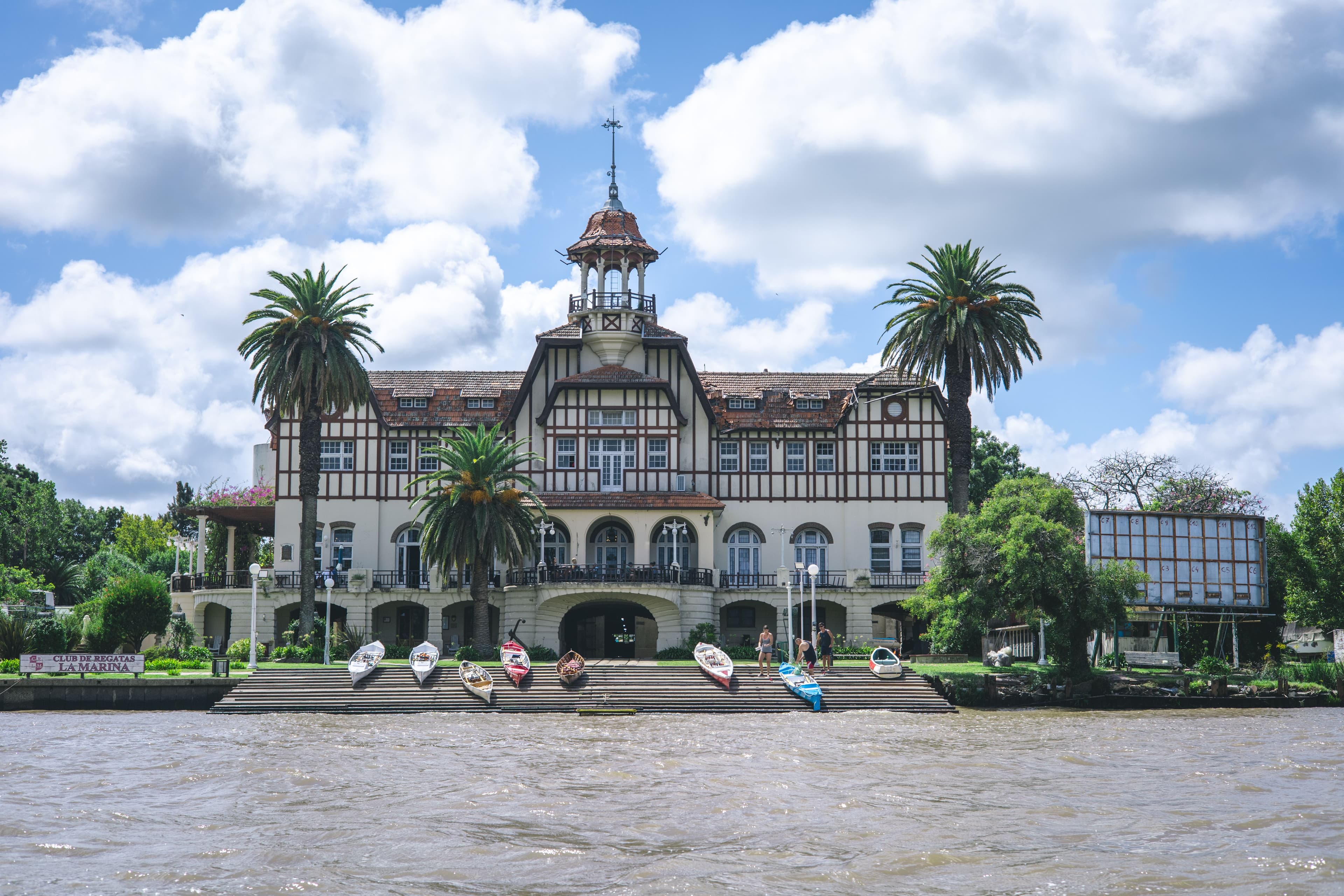 The grand Club de Regatas La Marina along the river.