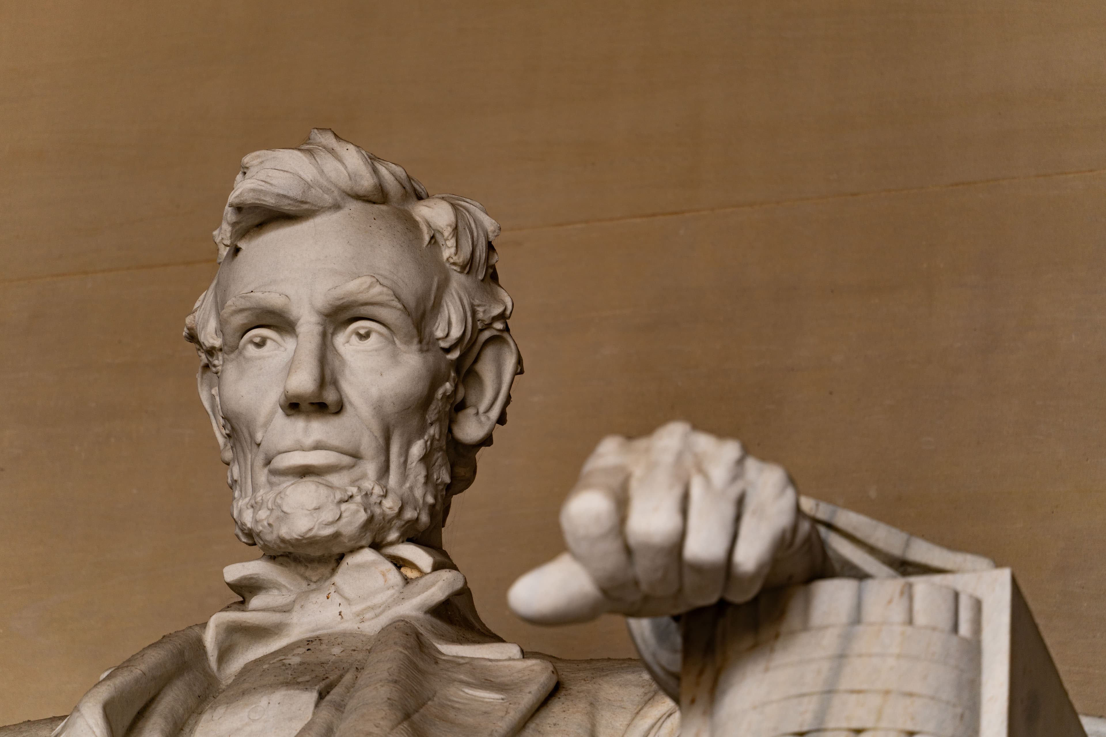Detailed view of Abraham Lincoln's marble statue in Washington D.C.