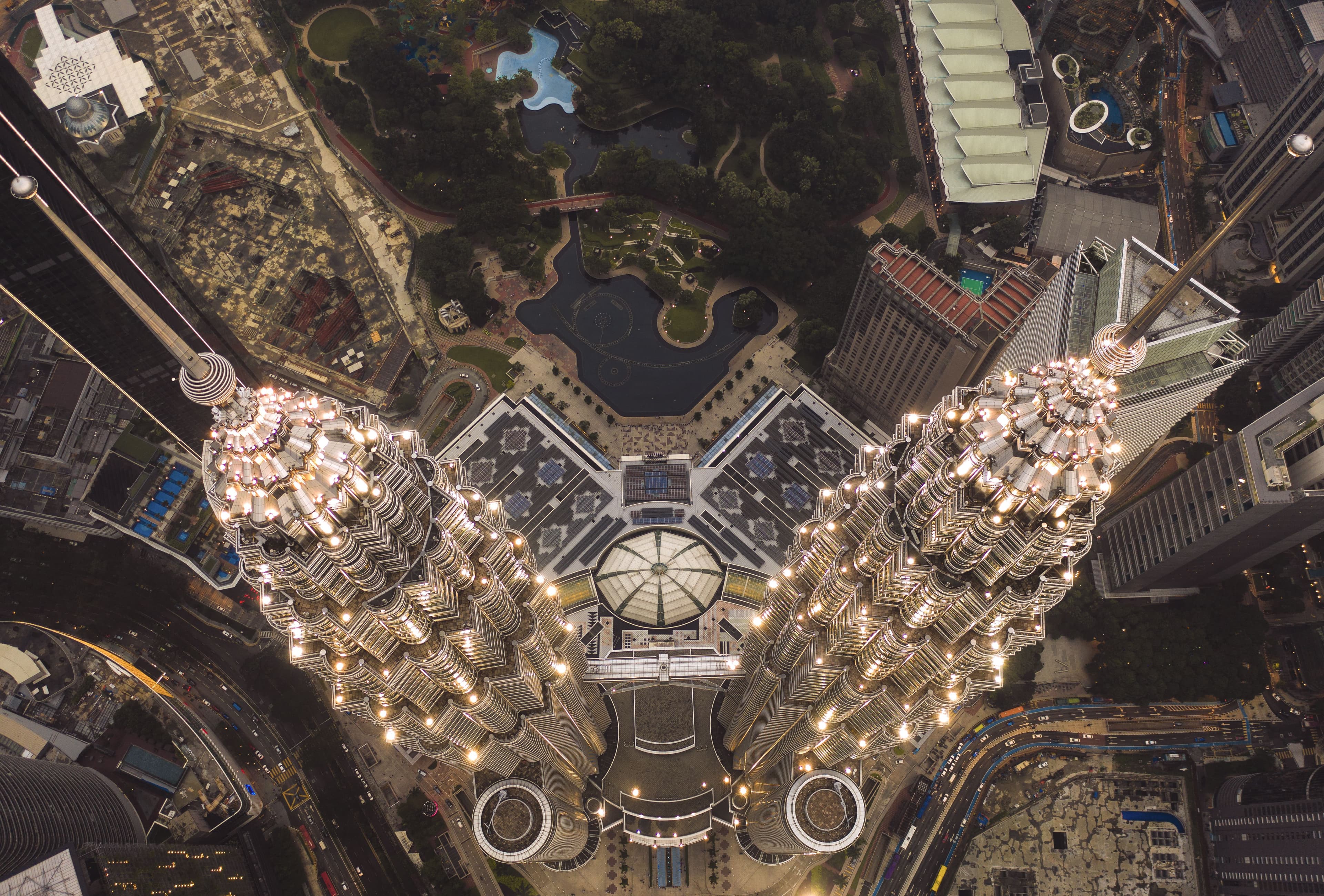 Stunning aerial perspective of the towers' illuminated spires.