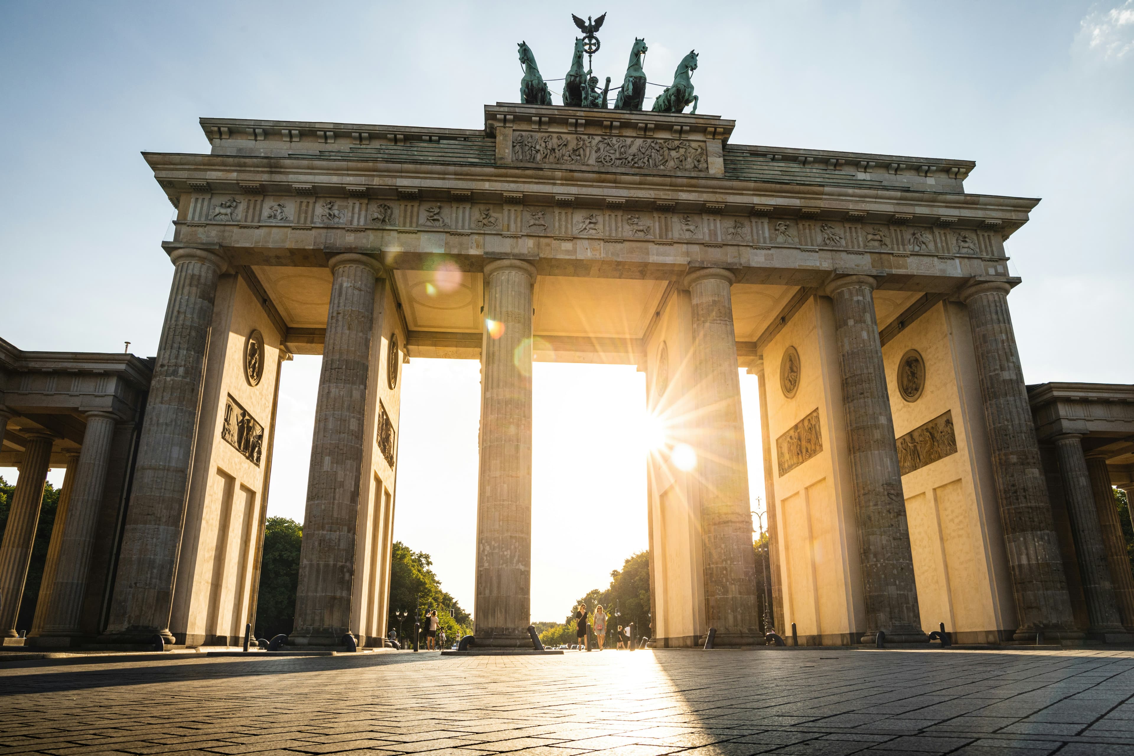 Golden sunbeams through the historic columns.
