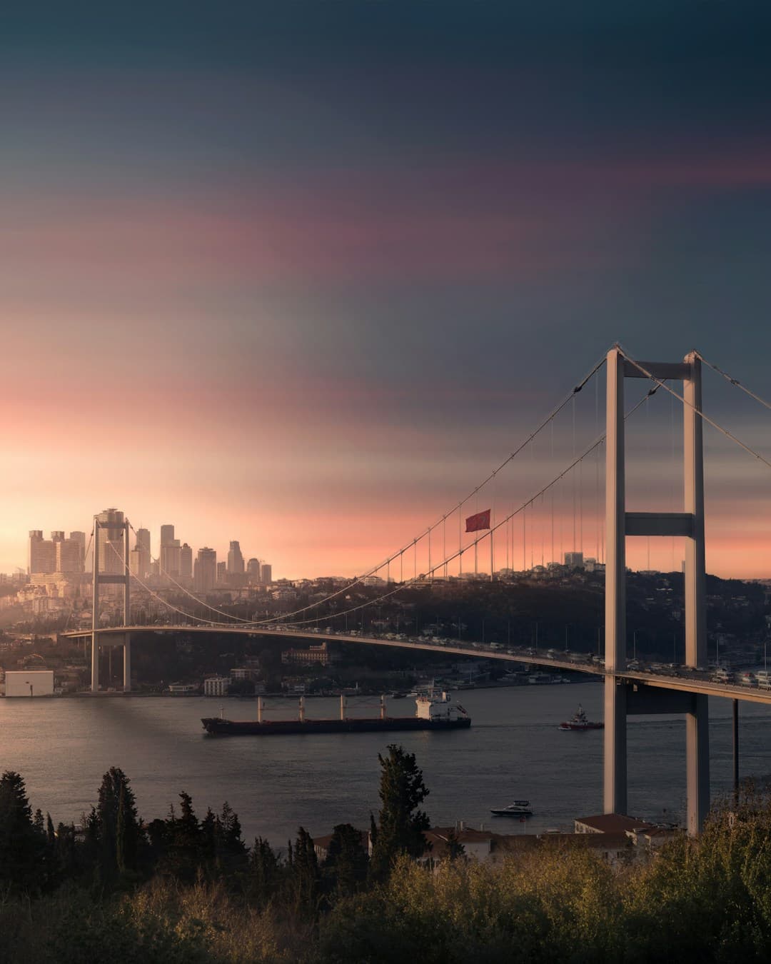 Sunset view of Fatih Sultan Mehmet Bridge and Istanbul skyline from Otağtepe.
