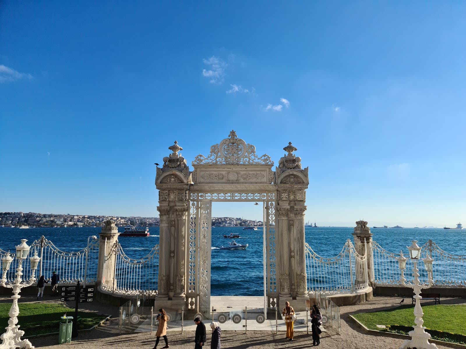 Ornate Dolmabahçe Palace gates overlooking the Bosphorus in Istanbul.